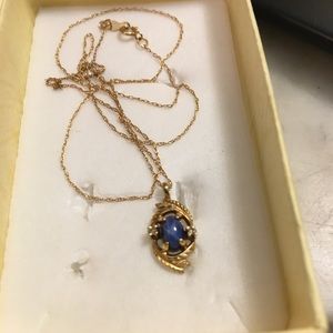 Genuine blue star sapphire with two diamond chips